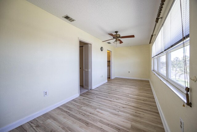 10037 62nd Ter N Unit 23, Saint Petersburg, FL 33708 - spare room featuring ceiling fan, a textured ceiling, and light wood finished floors