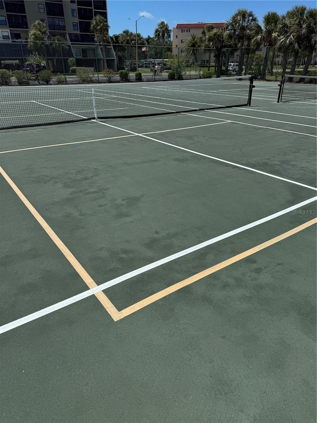 10037 62nd Ter N Unit 23, Saint Petersburg, FL 33708 - view of tennis court with community basketball court