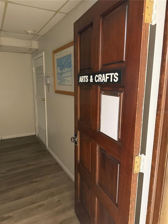 10037 62nd Ter N Unit 23, Saint Petersburg, FL 33708 - corridor with dark wood-type flooring and a paneled ceiling