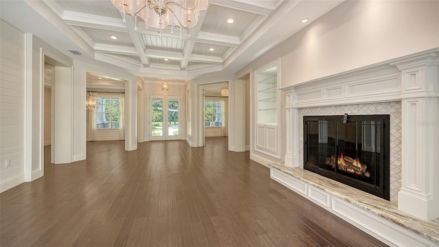 6050 Saddle Oak Trl, Sarasota, FL 34241 - unfurnished living room with a chandelier, a tile fireplace, beamed ceiling, dark wood finished floors, and coffered ceiling