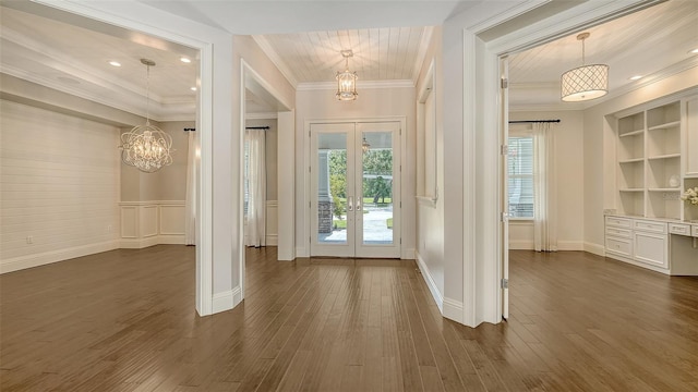 6050 Saddle Oak Trl, Sarasota, FL 34241 - foyer with a chandelier, french doors, healthy amount of natural light, crown molding, and dark wood finished floors