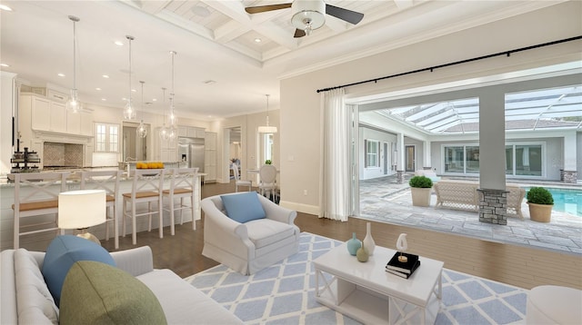 6050 Saddle Oak Trl, Sarasota, FL 34241 - living area featuring wood finished floors, beamed ceiling, ornamental molding, coffered ceiling, and ceiling fan