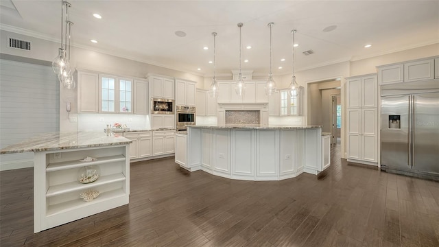 6050 Saddle Oak Trl, Sarasota, FL 34241 - kitchen with built in appliances, open shelves, dark wood-type flooring, crown molding, and a spacious island