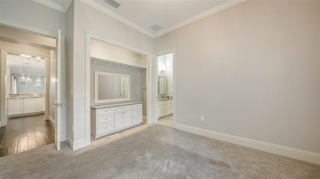 6050 Saddle Oak Trl, Sarasota, FL 34241 - unfurnished bedroom with light colored carpet, ornamental molding, and ensuite bathroom