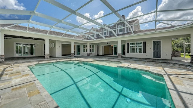 6050 Saddle Oak Trl, Sarasota, FL 34241 - outdoor pool featuring a patio, a ceiling fan, and glass enclosure