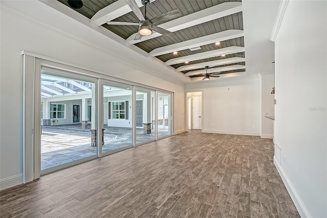6050 Saddle Oak Trl, Sarasota, FL 34241 - empty room with ceiling fan, a wood ceiling with exposed beams, wood finished floors, and french doors
