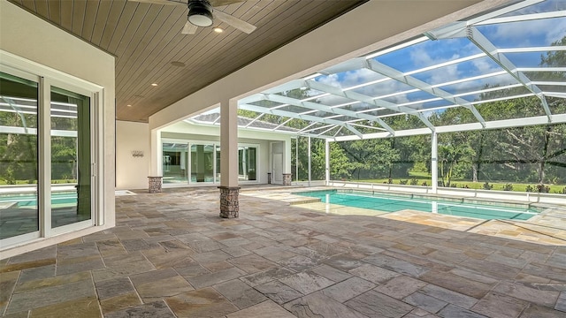 6050 Saddle Oak Trl, Sarasota, FL 34241 - outdoor pool featuring a patio area, ceiling fan, and glass enclosure