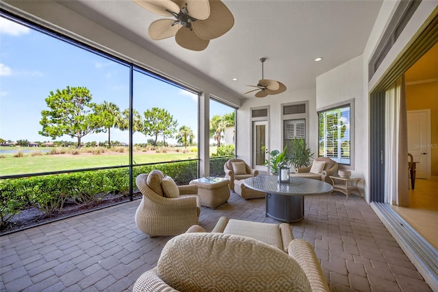 5104 Benito Ct, Bradenton, FL 34211 - sunroom featuring ceiling fan and an outdoor living space