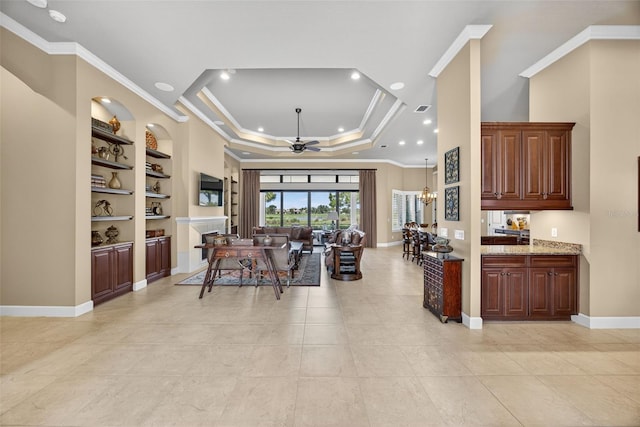 5104 Benito Ct, Bradenton, FL 34211 - living area featuring a ceiling fan, crown molding, built in features, light tile patterned flooring, and recessed lighting