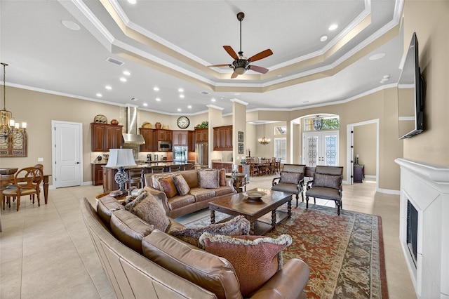 5104 Benito Ct, Bradenton, FL 34211 - living area featuring a chandelier, ornamental molding, a raised ceiling, recessed lighting, and ceiling fan