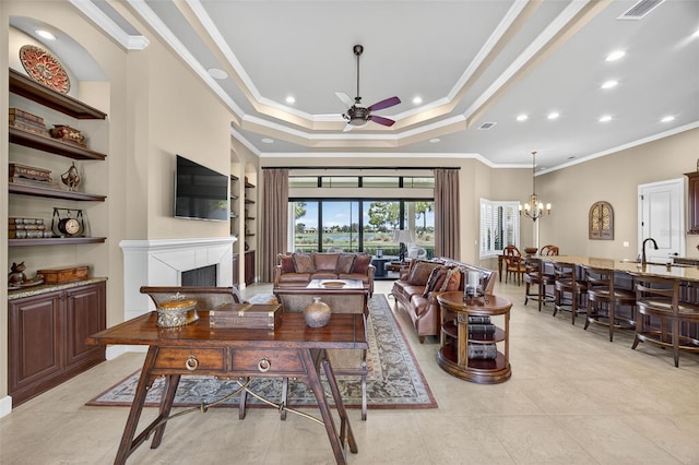 5104 Benito Ct, Bradenton, FL 34211 - living area with a ceiling fan, a fireplace, a raised ceiling, ornamental molding, and recessed lighting