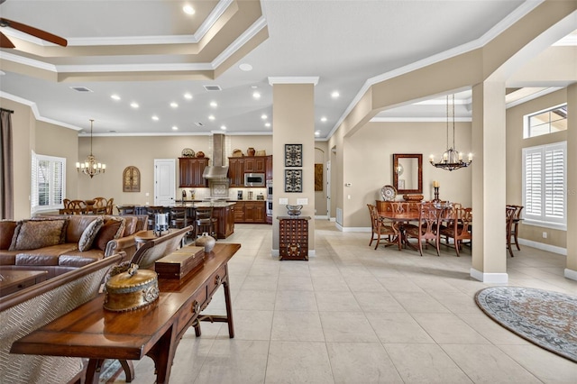 5104 Benito Ct, Bradenton, FL 34211 - living room with a chandelier, light tile patterned flooring, ornamental molding, recessed lighting, and a ceiling fan