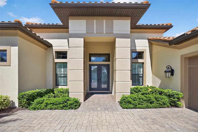 5104 Benito Ct, Bradenton, FL 34211 - entrance to property with french doors, stucco siding, and a tile roof