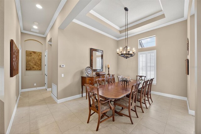 5104 Benito Ct, Bradenton, FL 34211 - dining room featuring crown molding, a chandelier, light tile patterned flooring, a raised ceiling, and recessed lighting