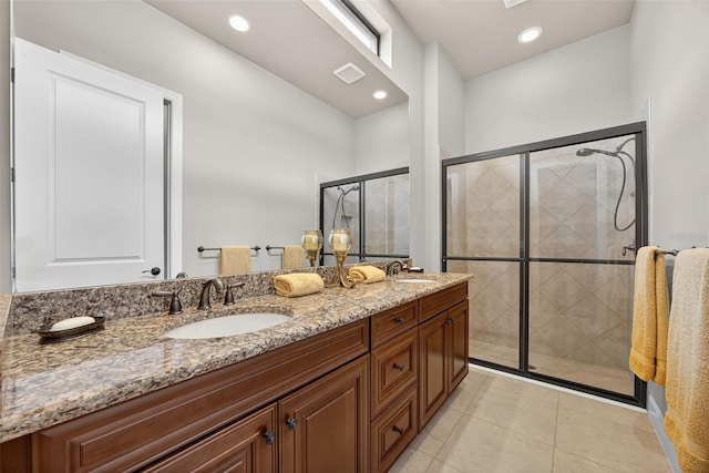 5104 Benito Ct, Bradenton, FL 34211 - full bath featuring double vanity, a shower stall, tile patterned floors, and recessed lighting