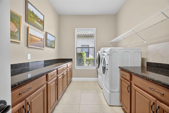 5104 Benito Ct, Bradenton, FL 34211 - laundry room with washer and clothes dryer, light tile patterned floors, and cabinet space