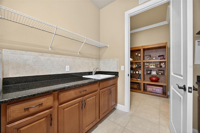 5104 Benito Ct, Bradenton, FL 34211 - laundry room featuring ornamental molding and light tile patterned flooring