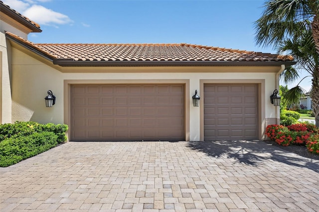 5104 Benito Ct, Bradenton, FL 34211 - garage featuring decorative driveway
