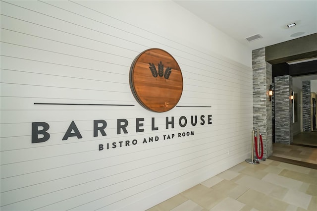 5104 Benito Ct, Bradenton, FL 34211 - corridor featuring tile patterned floors and wooden walls