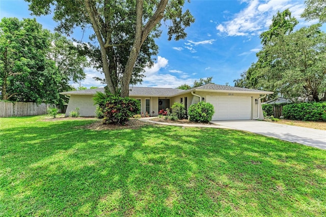 2512 Jamaica St, Sarasota, FL 34231 - single story home featuring a garage, concrete driveway, and stucco siding