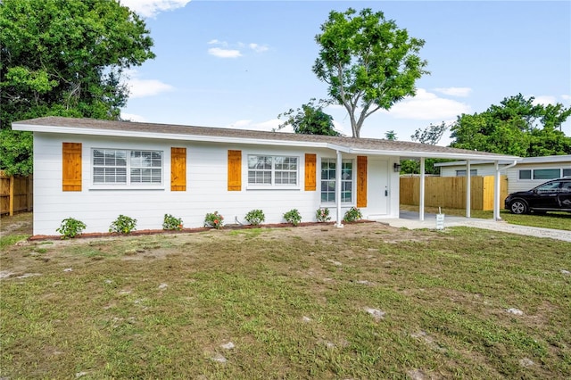 2802 21st St W, Bradenton, FL 34205 - ranch-style home featuring an attached carport and concrete driveway