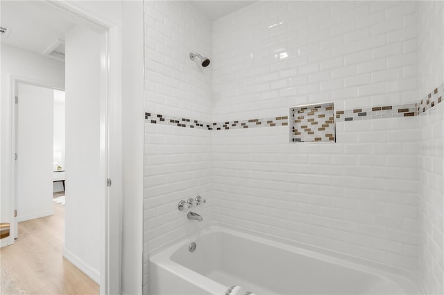 2802 21st St W, Bradenton, FL 34205 - full bathroom with washtub / shower combination and wood finished floors