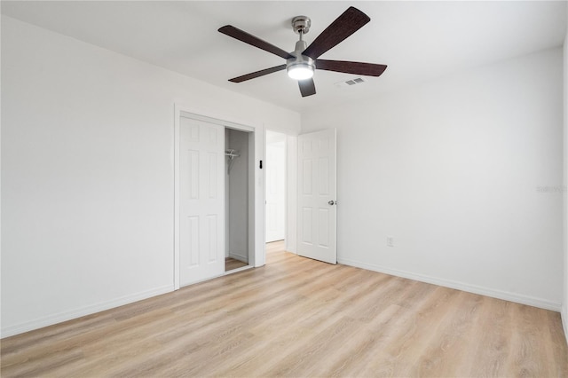 2802 21st St W, Bradenton, FL 34205 - unfurnished bedroom with light wood finished floors, a closet, and ceiling fan