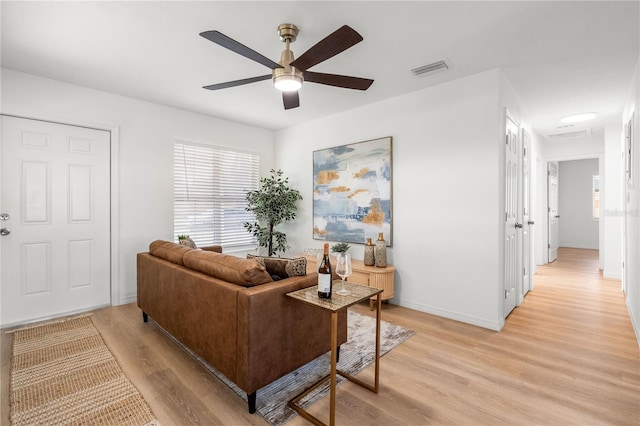 2802 21st St W, Bradenton, FL 34205 - living room with light wood finished floors, ceiling fan, and healthy amount of natural light