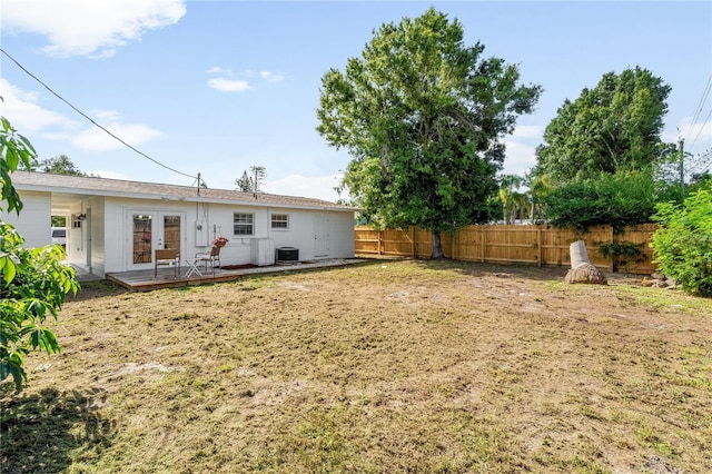 2802 21st St W, Bradenton, FL 34205 - rear view of house with french doors, a fenced backyard, and a deck