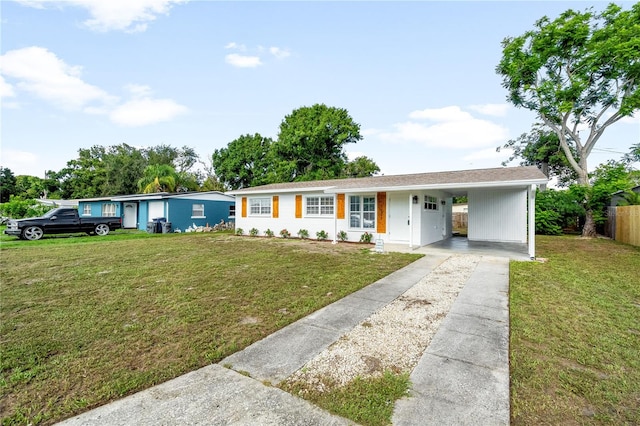 2802 21st St W, Bradenton, FL 34205 - ranch-style house with concrete driveway and an attached carport