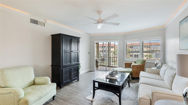 1257 S Portofino Dr Unit 306, Sarasota, FL 34242 - living room featuring ceiling fan, ornamental molding, and light wood finished floors