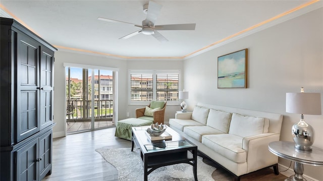 1257 S Portofino Dr Unit 306, Sarasota, FL 34242 - living room featuring ornamental molding, a ceiling fan, and light wood-style floors