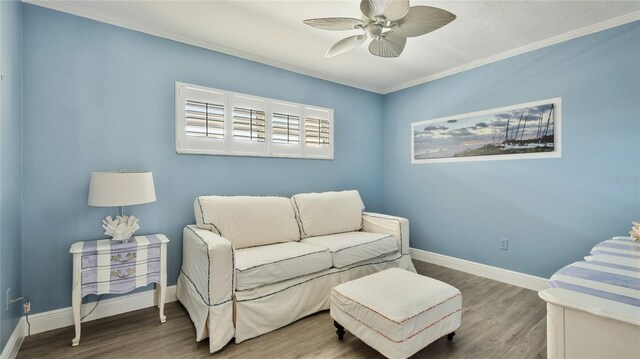 1257 S Portofino Dr Unit 306, Sarasota, FL 34242 - living area featuring a ceiling fan, wood finished floors, and ornamental molding