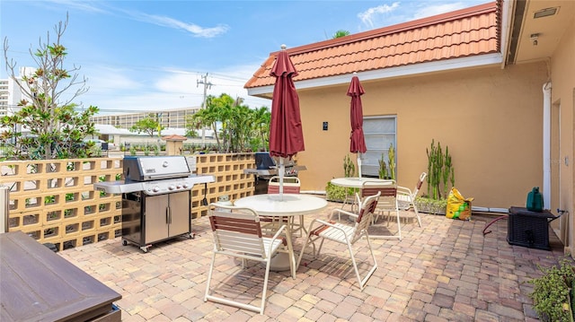 1257 S Portofino Dr Unit 306, Sarasota, FL 34242 - view of patio with area for grilling and outdoor dining space
