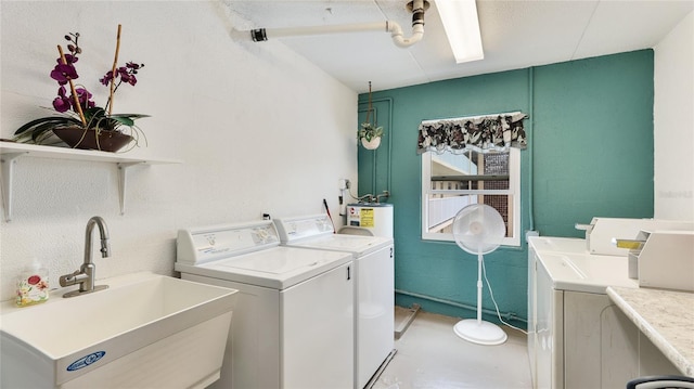 1257 S Portofino Dr Unit 306, Sarasota, FL 34242 - washroom with independent washer and dryer and water heater