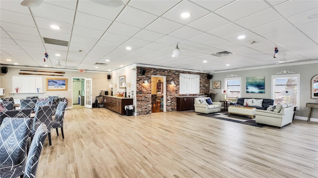 1257 S Portofino Dr Unit 306, Sarasota, FL 34242 - living room with crown molding, light wood finished floors, a drop ceiling, and recessed lighting