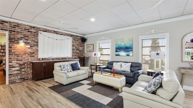 1257 S Portofino Dr Unit 306, Sarasota, FL 34242 - living area featuring light wood-type flooring, crown molding, and a paneled ceiling