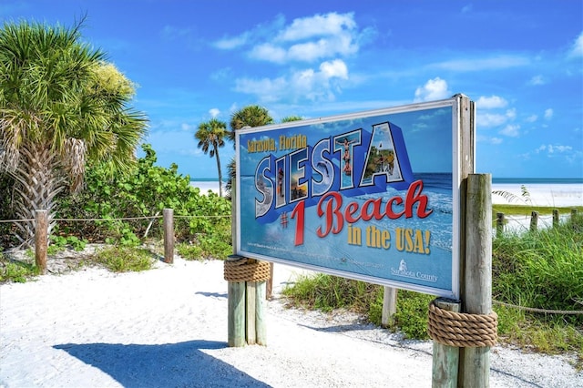 1257 S Portofino Dr Unit 306, Sarasota, FL 34242 - community sign featuring a water view