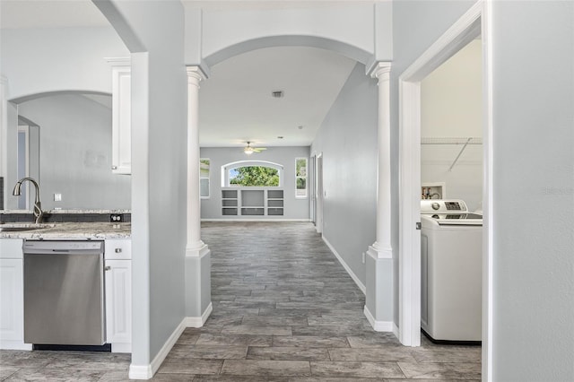 1042 Whitegate Ct, Sarasota, FL 34232 - hall with washer / clothes dryer, ornate columns, and wood finished floors