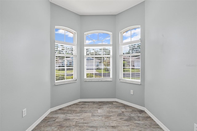 1042 Whitegate Ct, Sarasota, FL 34232 - spare room with wood finished floors and baseboards