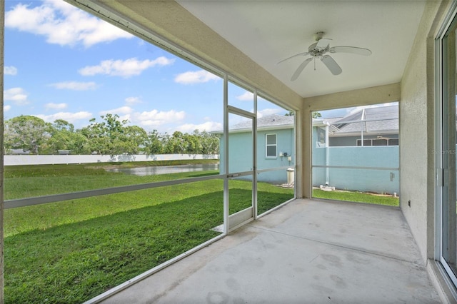 1042 Whitegate Ct, Sarasota, FL 34232 - unfurnished sunroom with a water view and ceiling fan