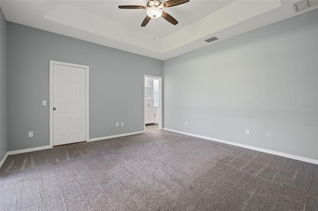 1042 Whitegate Ct, Sarasota, FL 34232 - carpeted empty room with a tray ceiling and ceiling fan
