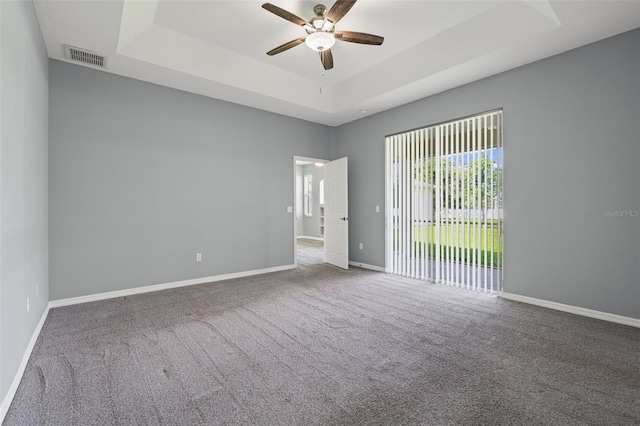 1042 Whitegate Ct, Sarasota, FL 34232 - spare room featuring a raised ceiling, ceiling fan, and carpet