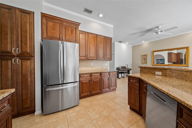 7115 39th Ln E, Sarasota, FL 34243 - kitchen featuring freestanding refrigerator, dishwasher, decorative backsplash, ceiling fan, and light tile patterned flooring