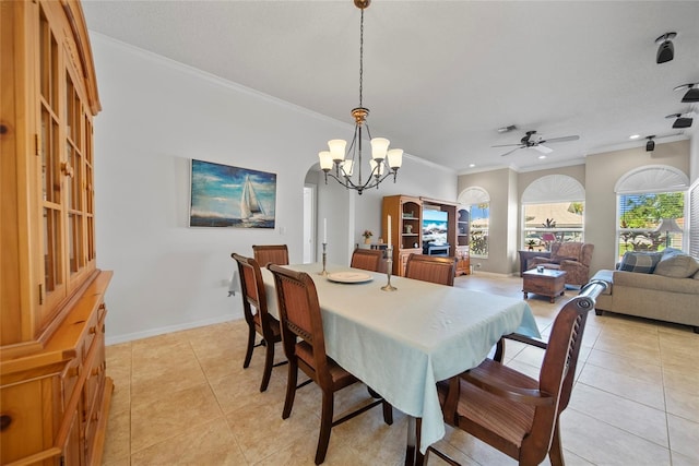 7115 39th Ln E, Sarasota, FL 34243 - dining room with ornamental molding, light tile patterned floors, a chandelier, ceiling fan, and arched walkways