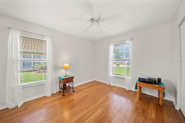 7115 39th Ln E, Sarasota, FL 34243 - spare room featuring light wood-style flooring and ceiling fan