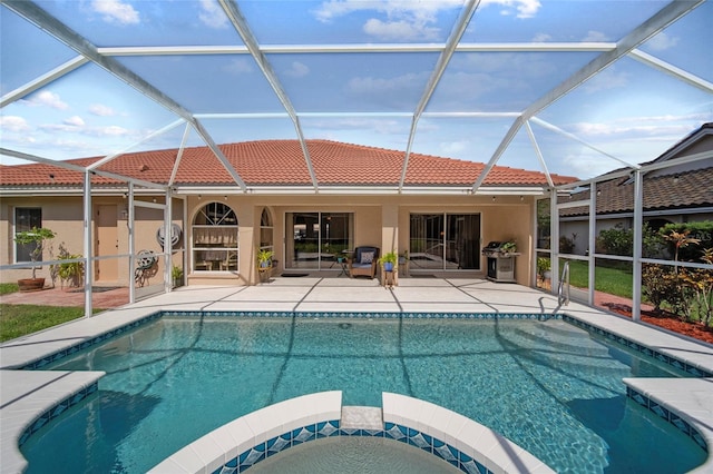 7115 39th Ln E, Sarasota, FL 34243 - swimming pool featuring glass enclosure, a patio area, and grilling area