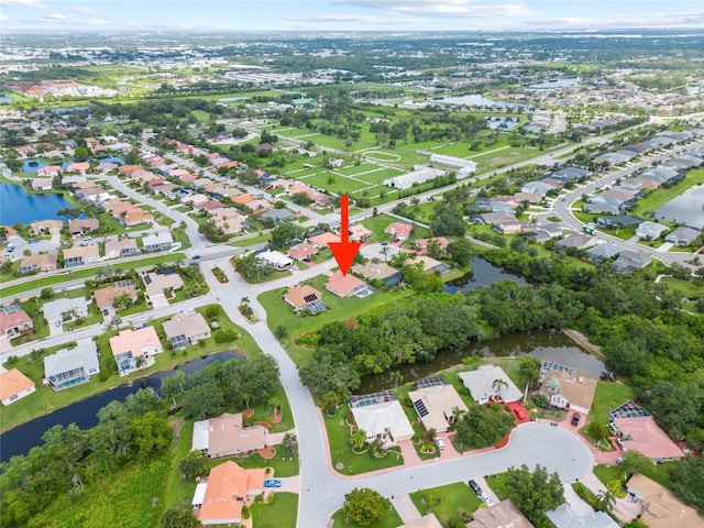 7115 39th Ln E, Sarasota, FL 34243 - aerial overview of property's location featuring a large body of water and nearby suburban area