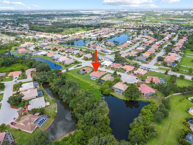 7115 39th Ln E, Sarasota, FL 34243 - aerial overview of property's location featuring a large body of water and nearby suburban area