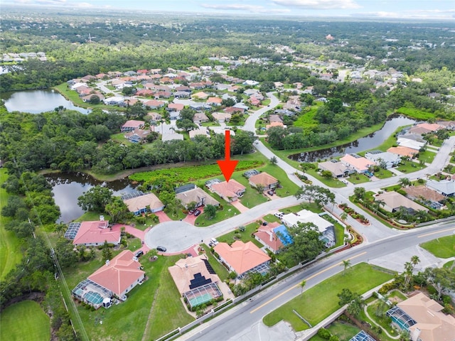 7115 39th Ln E, Sarasota, FL 34243 - aerial overview of property's location featuring a nearby body of water and nearby suburban area